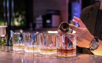 Bartender pouring whiskey drinks @ YOTEL