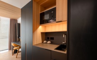 Close up of kitchenette, sink and microwave