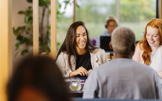 People sitting at a table laughing