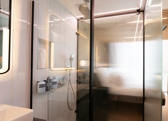 Shower cubicle behind frosted glass 